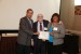 Dr. Nagib Callaos, General Chair, giving Dr. Emma Garrison-Alexander and Dr. Hari Kuchibhotla a certificate of appreciation for volunteering time and effort to make an additional presentation for Interdisciplinary Communication.
